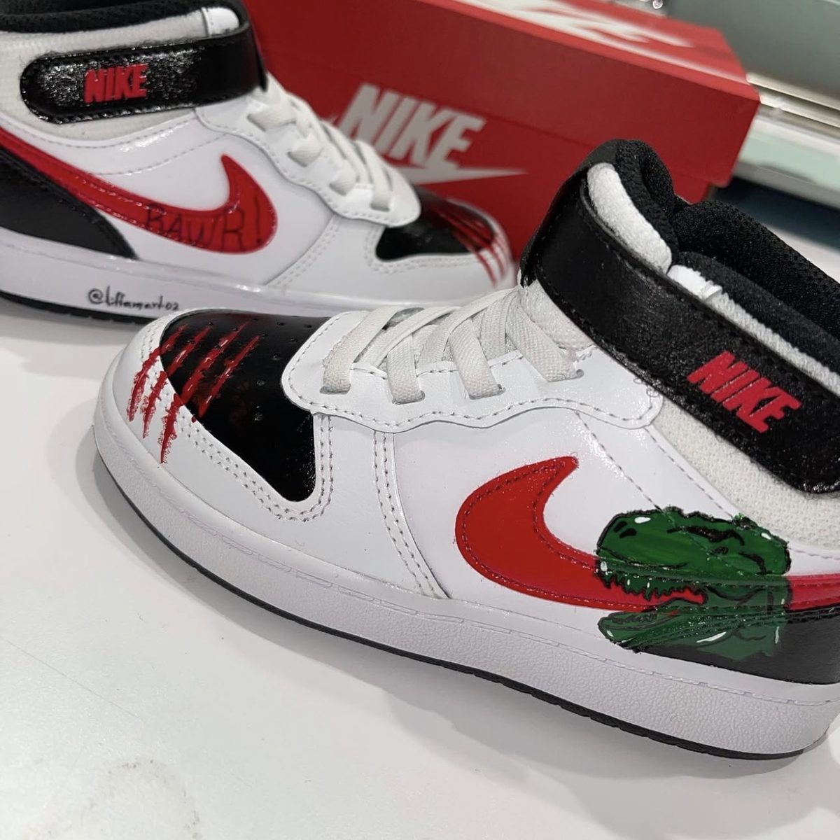 Hand-painted Nike sneakers with dinosaur artwork